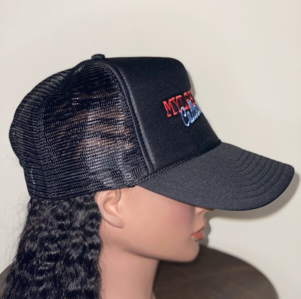 Profile view of mannequin wearing black baseball cap