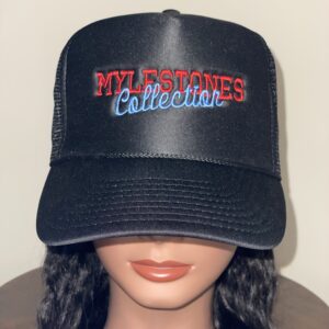 Mannequin wearing a black Mylestones Collection hat with red and light blue lettering